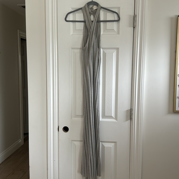 stretchy knit fabrication
Twist halter neckline
Three-button closure at neck - Picture 2 of 4